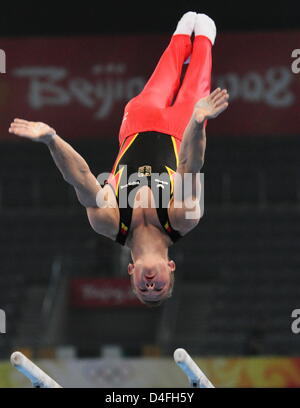 German Fabian Hambuechen exercises on the parallel bars during an artistic gymnastics practise session in the National Indoor Stadium, Beijing, China, 06 August 2008. Photo: Frank May dpa ###dpa### Stock Photo