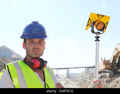 Worker standing in quarry Stock Photo