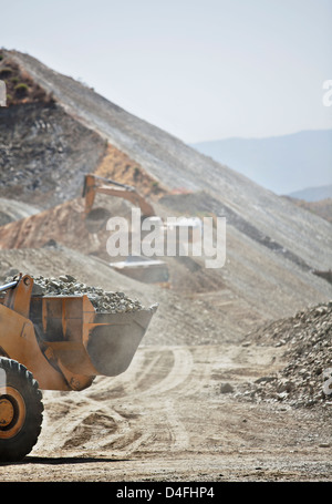 Diggers working in quarry Stock Photo