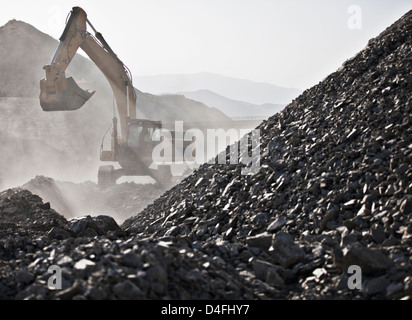 Digger working in quarry Stock Photo