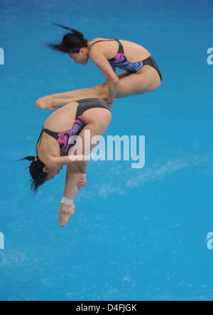 China's Jingjing Guo and Minxia Wu during the women's synchro 3 m springboard final at the Olympic Games in Beijing 2008, China, 10 August 2008. Photo: Bernd Thissen dpa (c) dpa - Bildfunk Stock Photo