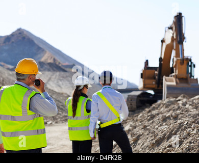 Business people talking in quarry Stock Photo