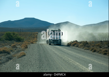 Tipper truck carrying quarried stone on a gravel road in the Karoo region South Africa Stock Photo