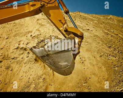 Digger working in quarry Stock Photo