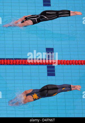 Britta Steffen from Germany (top) dives to compete against Lisbeth Trickett from Australia during the women's swimming 100m freestyle final at the Beijing 2008 Olympic Games in Beijing China, 15 August 2008. Steffen won in 53.12 seconds and set up a new olympic record. Photo: Bernd Thissen dpa ###dpa### Stock Photo