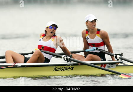 Germany's Marie-Louise Draeger (L) and Berit Annika Carow react after reachjing 4th place at Lightweight Women`s Double Sculls final at the Shunyi Olympic Rowing Park at the Beijing 2008 Olympic Games, China, 17 August 2008. Photo: Jens Buettner dpa (c) dpa - Bildfunk Stock Photo