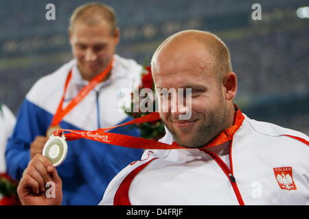 Silver medalist Piotr Malachowski of Poland (R) and gold medalist Gerd Kanter of Estonia leave the podium after the medal ceremony for Men`s Discus Throw in the National Stadium during the Beijing 2008 Olympic Games, Beijing, China, 20 August 2008. Photo: Jens Buettner dpa ###dpa### Stock Photo