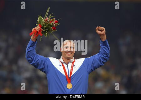 Gold medalist Gerd Kanter of Estonia celebrates on the podium during the medal ceremony for the Men`s Discus Throw Final in the National Stadium during the Beijing 2008 Olympic Games in Beijing, China, 20 August 2008. Photo: Jens Buettner dpa ###dpa### Stock Photo