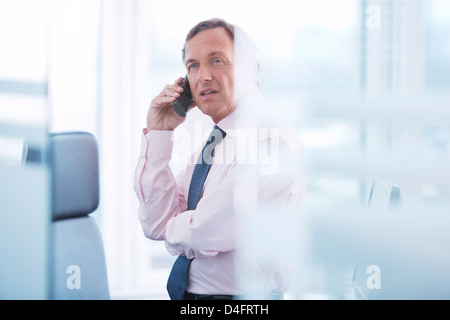 Businessman talking on cell phone Stock Photo