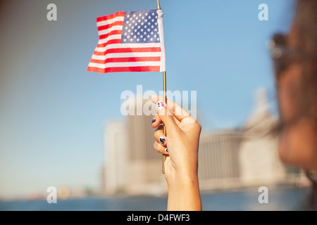 Woman with novelty nails waving American flag Stock Photo
