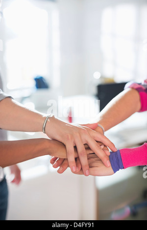 Close up of hands in circle together Stock Photo