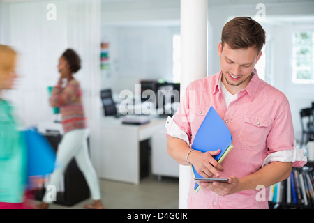 Businessman using digital tablet in office Stock Photo