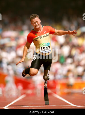 German athelete Heinrich Popow finishes second the 100m at the Beijing 2008 Paralympic Games in Beijing, China, 14 September 2008. Photo: ROLF VENNENBERND Stock Photo