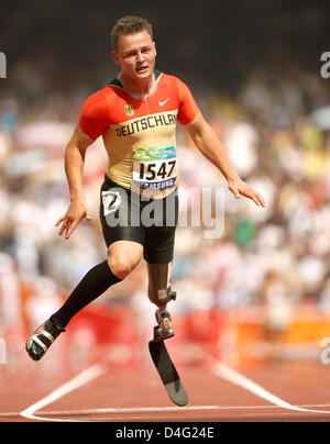 German athelete Heinrich Popow finishes second the 100m at the Beijing 2008 Paralympic Games in Beijing, China, 14 September 2008. Photo: ROLF VENNENBERND Stock Photo