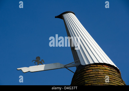 Kent oast house roof tops with Invicta  symbol on the sail. Stock Photo