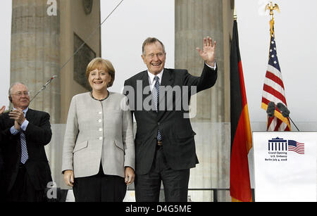 Former U.S. President George Bush sen. (R) and German Chancellor Angela Merkel (L) arrive for the inauguration of the new U.S. Embassy to Germany in Berlin, Germany, 04 July 2008. After nearly 70 years the U.S. Embassy has returned to its former location next to Brandenburg Gate. Some 4,500 guests were expected to attend the festive ceremony on the eve of US Independence Day. Photo Stock Photo