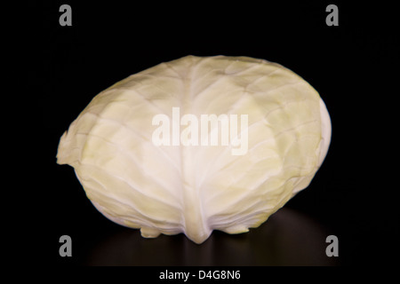 cut in half white cabbage isolated on a black background Stock Photo