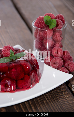 Raspberry Jello with fresh fruits Stock Photo