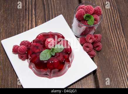 Raspberry Jello with fresh fruits Stock Photo