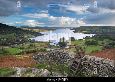 Footpath stile over dry stone wall, overlooking Lake Windermere, Lake District, Cumbria, England. Autumn (October) 2012 Stock Photo