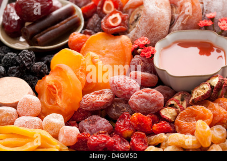 Various Chinese traditional preserved fruits and tea Stock Photo