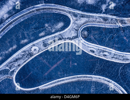 Ice pattern in frozen pond, Dartmoor, Devon, England. Winter (December) 2012. Stock Photo