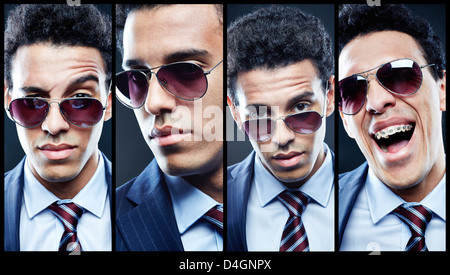 Young stylish man in sunglasses posing for camera Stock Photo