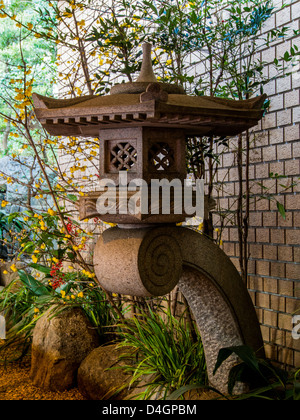 An unusual stone lantern,  or  ishidoro,  at Nogi Shrine, Tokyo, Japan, a contemporary variation of a traditional theme. Stock Photo