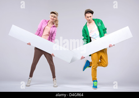 Two hip-hop young dancers showing empty boards Stock Photo