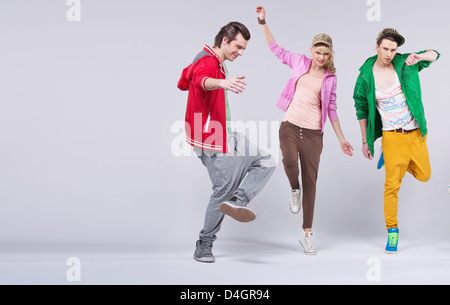 Group of cheerful young friends dancing together Stock Photo