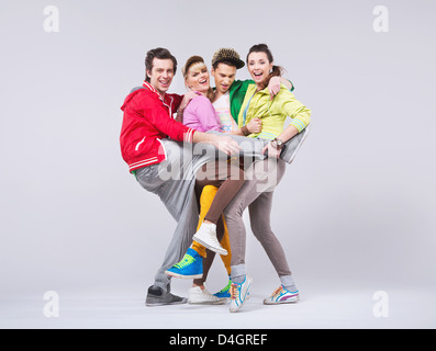 Two teenage couples in funny position Stock Photo
