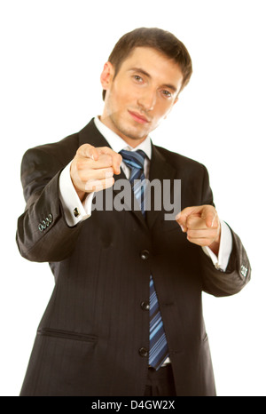 Very angry businessman pointing at the camera over white background Stock Photo