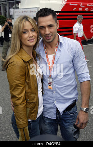 German boxer Felix Sturm and his girlfriend Jasmin pose in the paddock of Hockenheimring race track in Hockenheim, Germany, 20 July 2008. Photo: ROLAND WEIHRAUCH Stock Photo