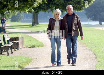 US-actor George Hamilton poses with his partner, doctor Barbara Sturm, in Duesseldorf, Germany, 16 June 2008. Photo: Horst Ossinger Stock Photo