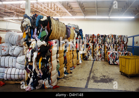 Salt Lake City Utah USA Bishops Storehouse Flourescent Lighting Bundles Of Clothes Stock Photo