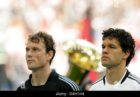 Michael Ballack, captain of Germany's national soccer squad and goalkeeper Jens Lehmann listen to the national anthems ahead of the soccer friendly Germany vs Serbia at 'Veltins Arena' in Gelsenkirchen, Germany, 31 May 2008. Germany won 2-1. Photo: Rolf Vennenbernd Stock Photo