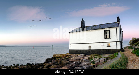 Panorama of an old house on the beach at Lepe in the New Forest. Stock Photo