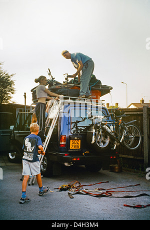 A car overloaded with bikes Stock Photo - Alamy