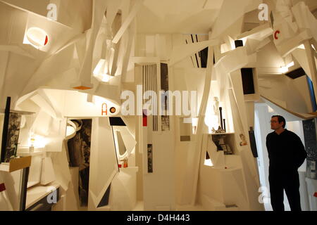 A visitor stands inside the reconstructed Kurt Schwitters work 'MERZ Building' (1920-1936) at state art gallery 'Staatliche Kunsthalle' in Baden-Baden, Germany, 22 October 2008. The artworks of companions and students of Russian avant-garde artist Kazimir Malevich are being presented in the exhibition 'From Surface to Space. Malevich and Early Modern Art'. It runs from 25 October u Stock Photo
