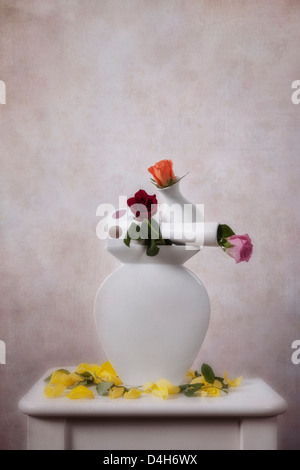 three flower vase stacked with roses Stock Photo