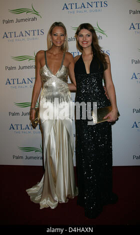 Sandy Meyer-Woelden, jewellery designer and ex-fiancee of Boris Becker, and her friend, model Janina Schmidt, arrive on the red carpet at Hotel ?Atlantis, The Palm? on the artificial island ?The Palm Jumeirah? in Dubai, UAE, 20 November 2008. The artificial island was inaugurated with a large party after seven years of construction. Numerous celebrities from all over the world atte Stock Photo