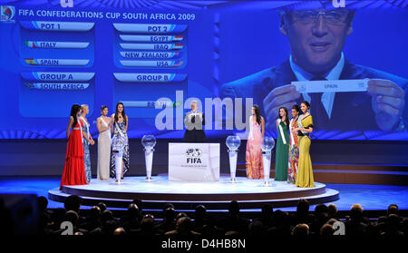 FIFA secretary general Jerome Valcke (C) presents the ticket for Spain at the drawing of the groups for the 2009 Confederations Cup in Johannesburg, South Africa, 22 November 2008. Photo: Gero Breloer Stock Photo