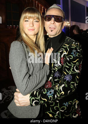 German guitar legend Rudolf Schenker of hard rock band Scorpions (R) and his girlfriend Tatjana (L) pose at the ?Movie meets Media? party in Hamburg, Germany, 08 December 2008. The party invited guests from show business, media and economy. Photo: Ulrich Perrey Stock Photo