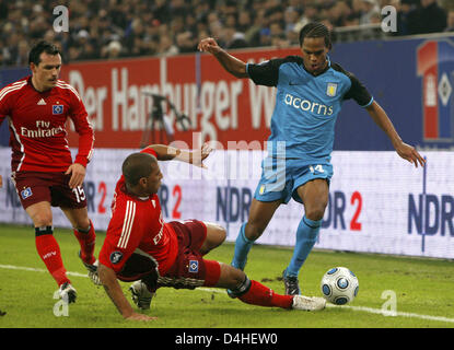 Hamburg?s Piotr Trochowski (L-R) and Jerome Boateng and Aston Villa?s Nathan Delfouneso vie for the ball during the UEFA Cup match Hamburg SV vs Aston Villa at HSH Nordbank Arena in Hamburg, Germany, 17 December 2008. The match ended 3-1. Photo: Marcus Brandt Stock Photo