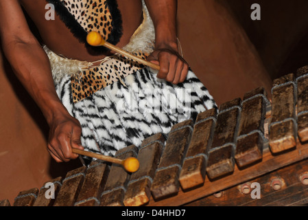 Eshowe, KwaZulu-Natal, South Africa, close up, hands of Zulu man playing xylophone, entertainment, theme village, people, culture, Shakaland Stock Photo