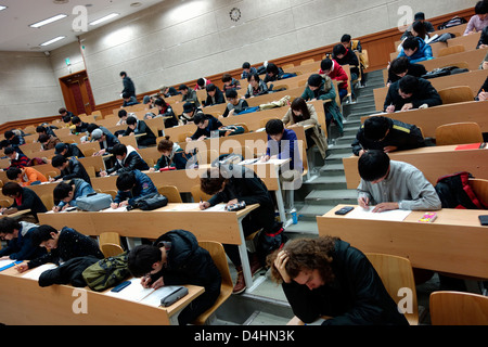 College students taking exam Stock Photo