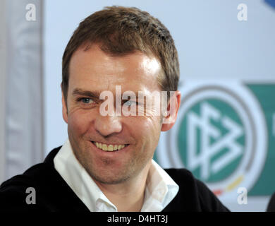 Hans-Dieter Flick, assistant coach of Germany?s national soccer squad, laughs during a press conference in Duesseldorf, Germany, 9 February 2009. The German national team prepares for a friendly against Norway?s national squad. The match will take place at LTU-Arena in Duesseldorf on 11 February 2009. Photo: Federico Gambarini Stock Photo