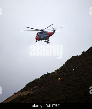 Edinburgh, Scotland, UK. 14th March 2013.  Arthur's Seat rescue by Royal Navy Rescue helicopter, 14 March 2013, Fire and Police emergency crews attended the scene when a young man  fell. Stock Photo