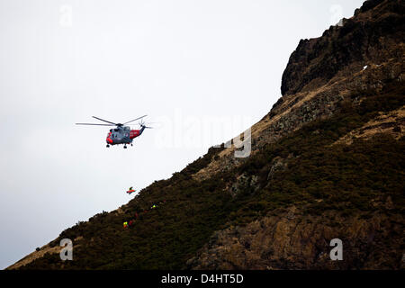 Edinburgh, Scotland, UK. 14th March 2013.  Arthur's Seat rescue by Royal Navy Rescue helicopter, 14 March 2013, Fire and Police emergency crews attended the scene when a young man  fell. Stock Photo