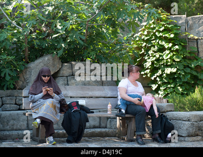 Rusr, Germany, Women Rust on a park bench at Europa-Park Stock Photo